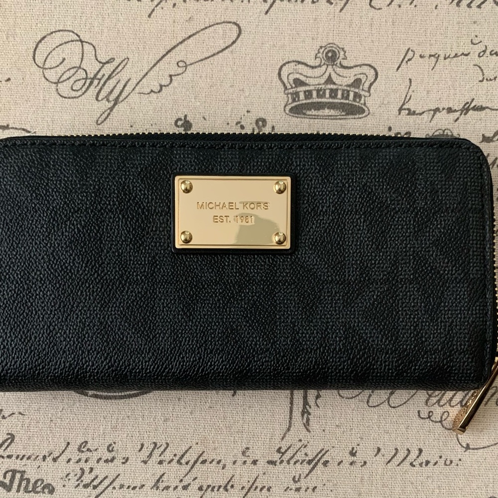 Michale Kors monogrammed (MK) black wallet with gold hardware.  Never used.